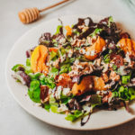 Summer stone fruit salad with peaches, lettuce, and balsamic honey dressing