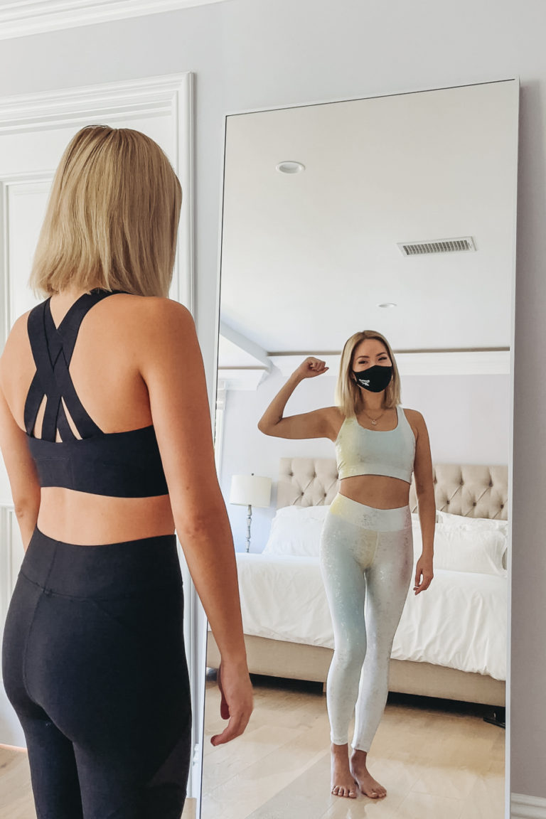 Girl wearing Terez workout clothes, leggings, and Reebok face mask for workout